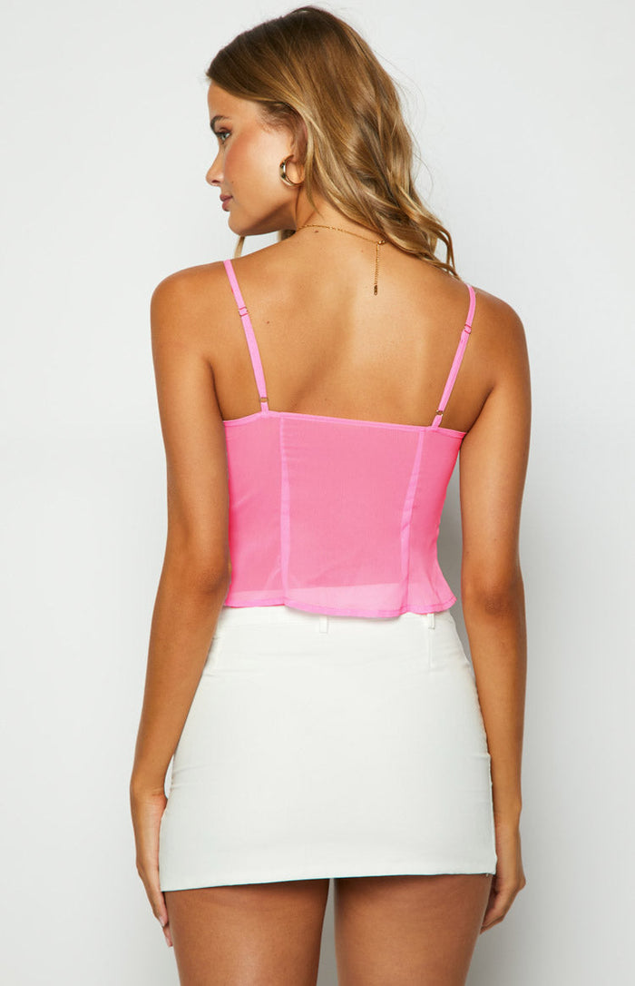 Rear view of the sheer pink cami top featuring adjustable spaghetti straps and vertical seam detailing