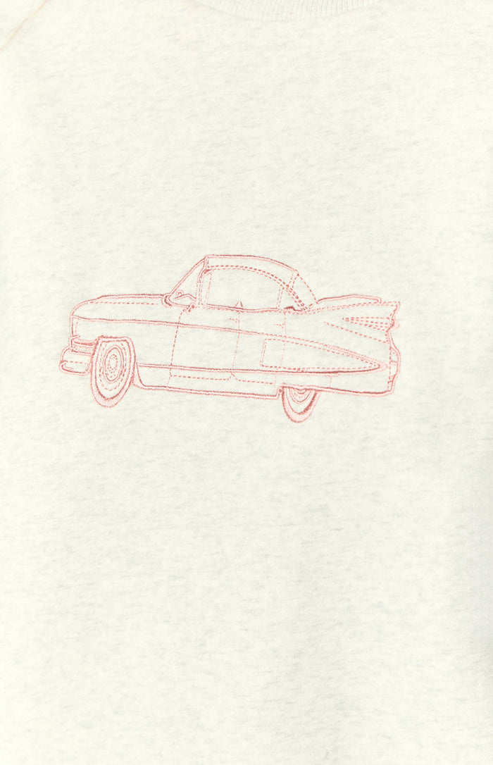 Close-up of the pink embroidered vintage car design on the grey crew neck sweater
