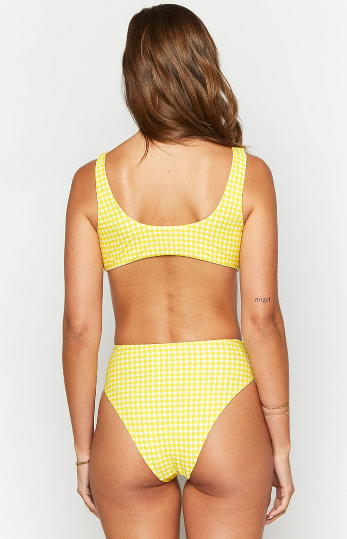 Rear view of a yellow gingham bikini top with a scoop back and wide shoulder straps