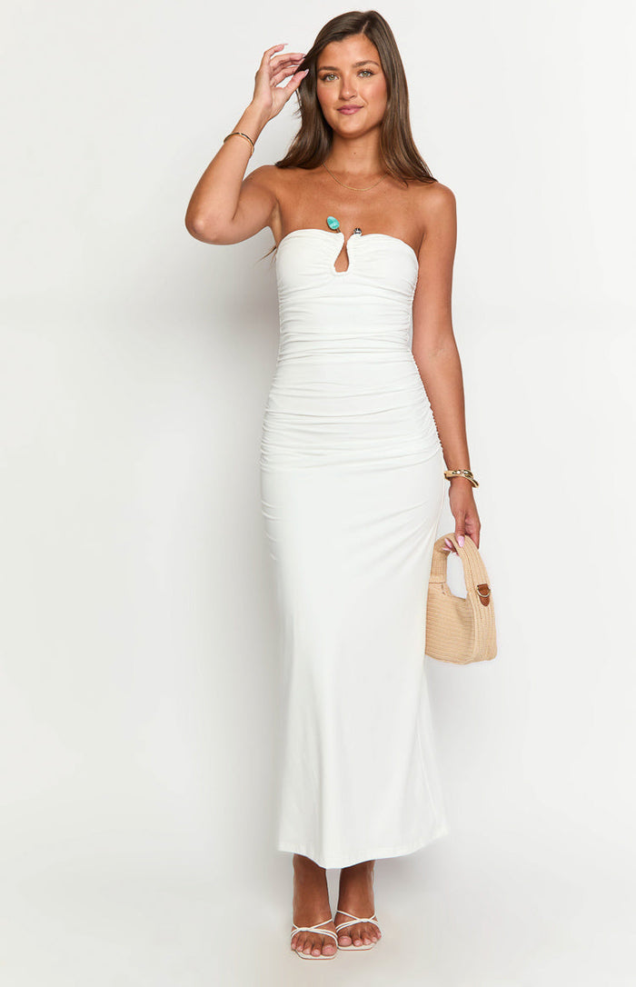 White strapless maxi dress featuring a front keyhole cutout and all-over ruching detail