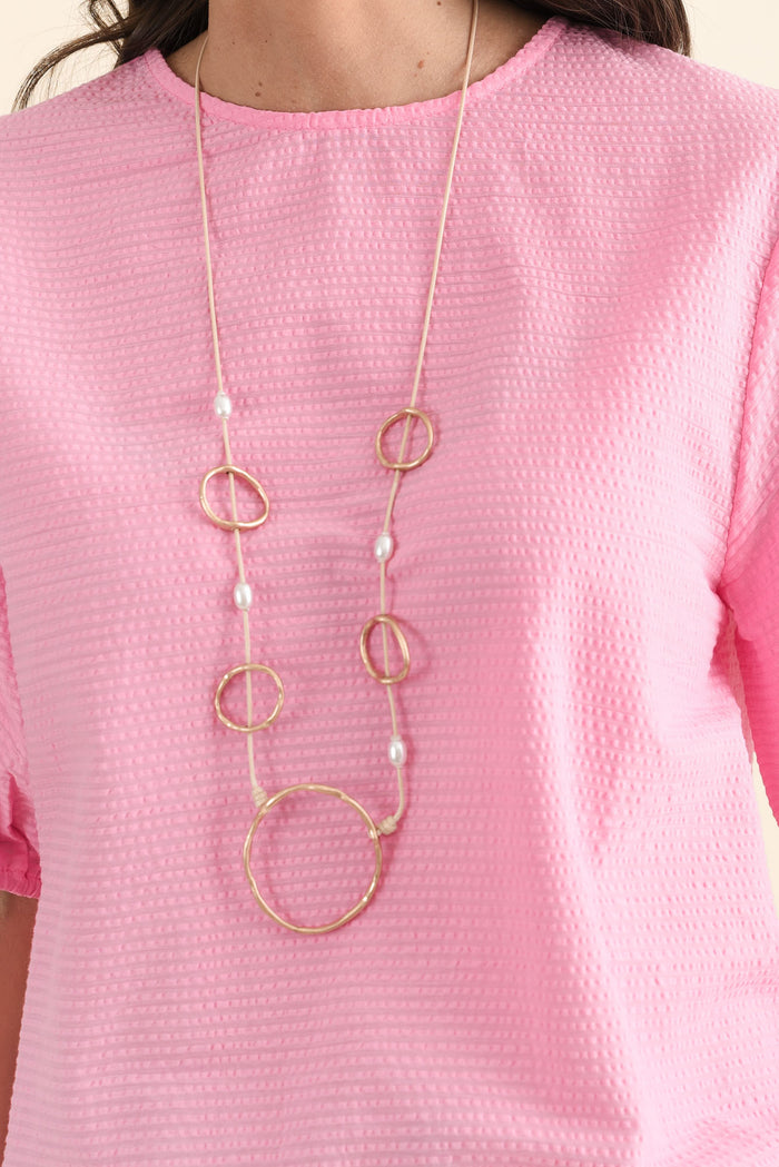 Astrid Pink Cotton Textured Top,brunette model,Close up of outfit,alt text|model:MJ