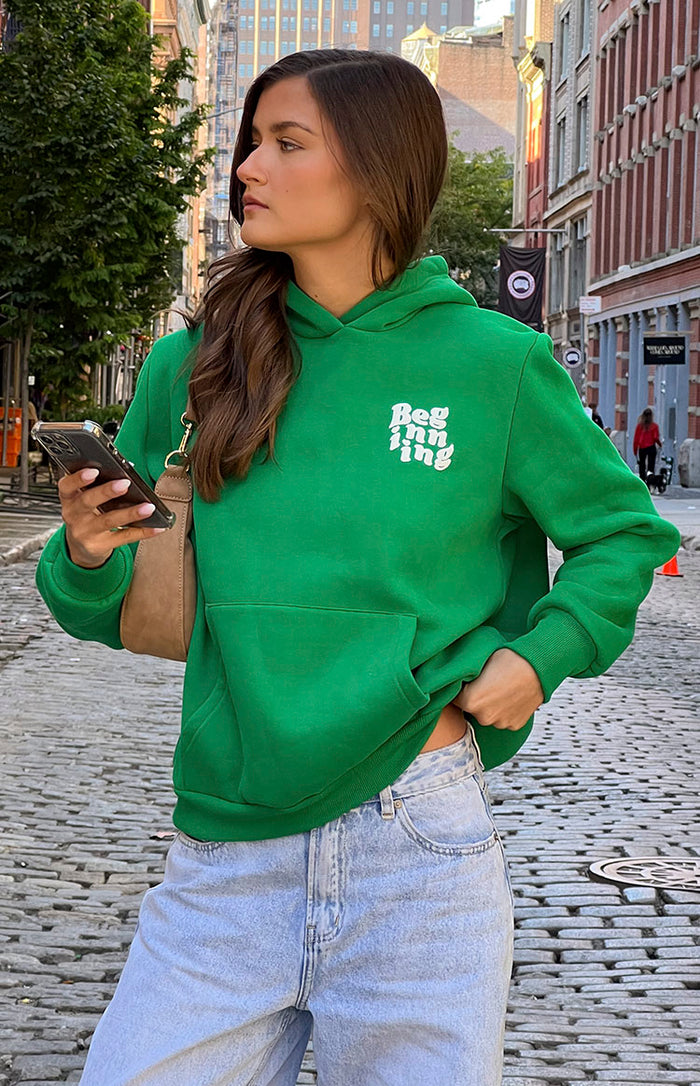 Beginning Boutique Beginning Green Snuggle Bubble Hoodie oversized green hoodie with white 'Beginning' text, front pouch pocket, and ribbed cuffs