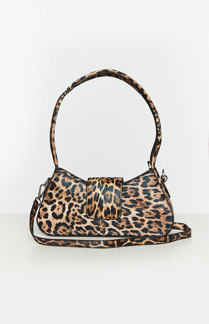Leopard print shoulder bag with a front flap closure, short top handle, and detachable cross-body strap