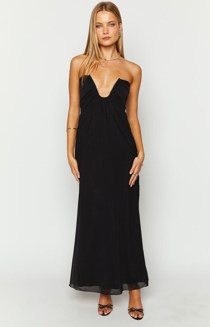 Black strapless maxi dress with a deep V-neckline and ruched bust detail, flowing to a sheer hem