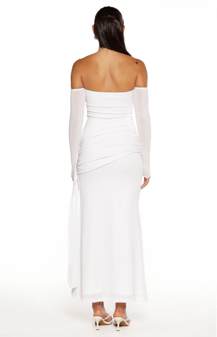 Rear view of a white off-shoulder maxi dress with sheer long sleeves and ruched detailing on the back