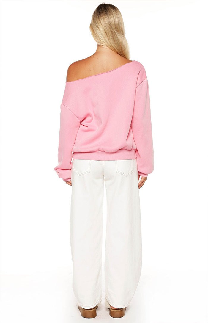 Rear view of a pink off-shoulder sweater with a relaxed fit and ribbed hem