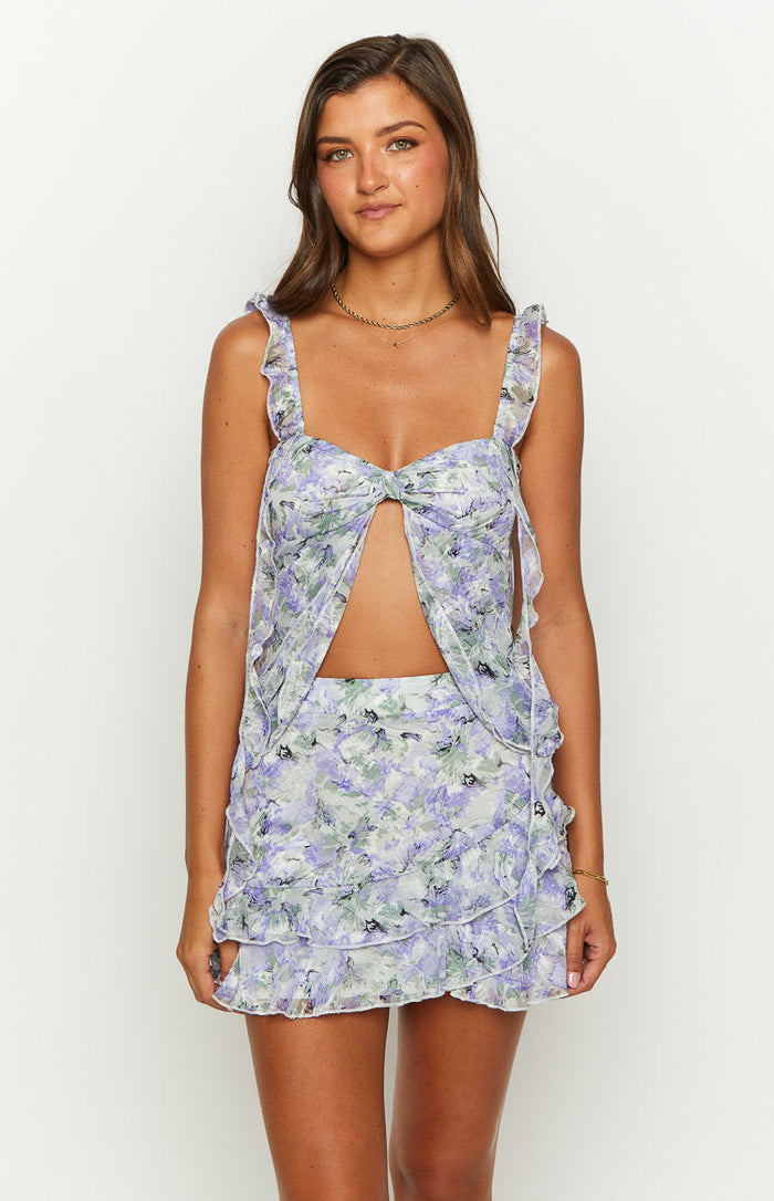 Front view of a purple floral print chiffon mini skirt with tiered ruffle layers