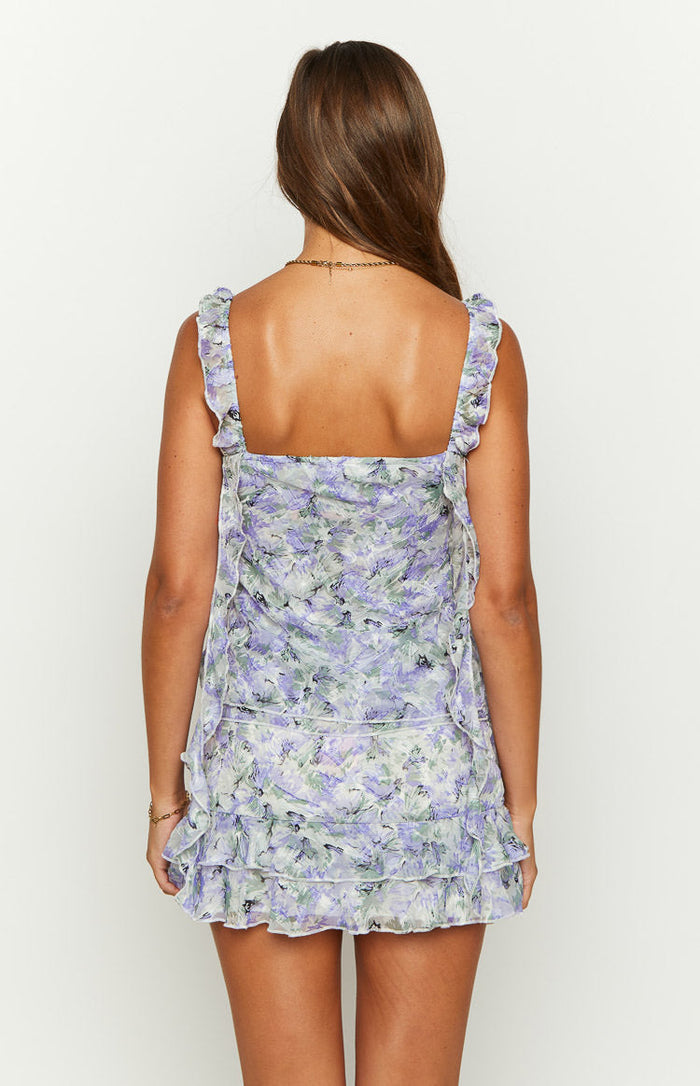 Rear view of a purple floral print chiffon mini skirt with tiered ruffles