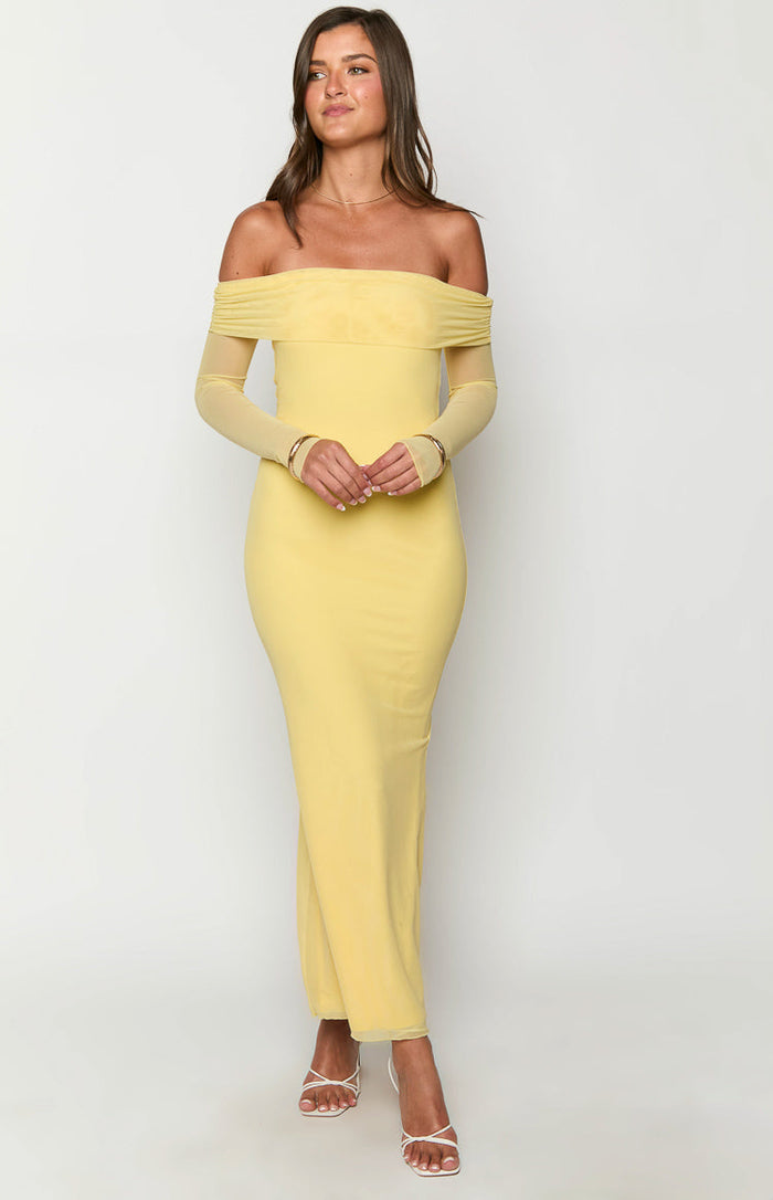Fitted yellow off-shoulder maxi dress with a ruched neckline and sheer long sleeves