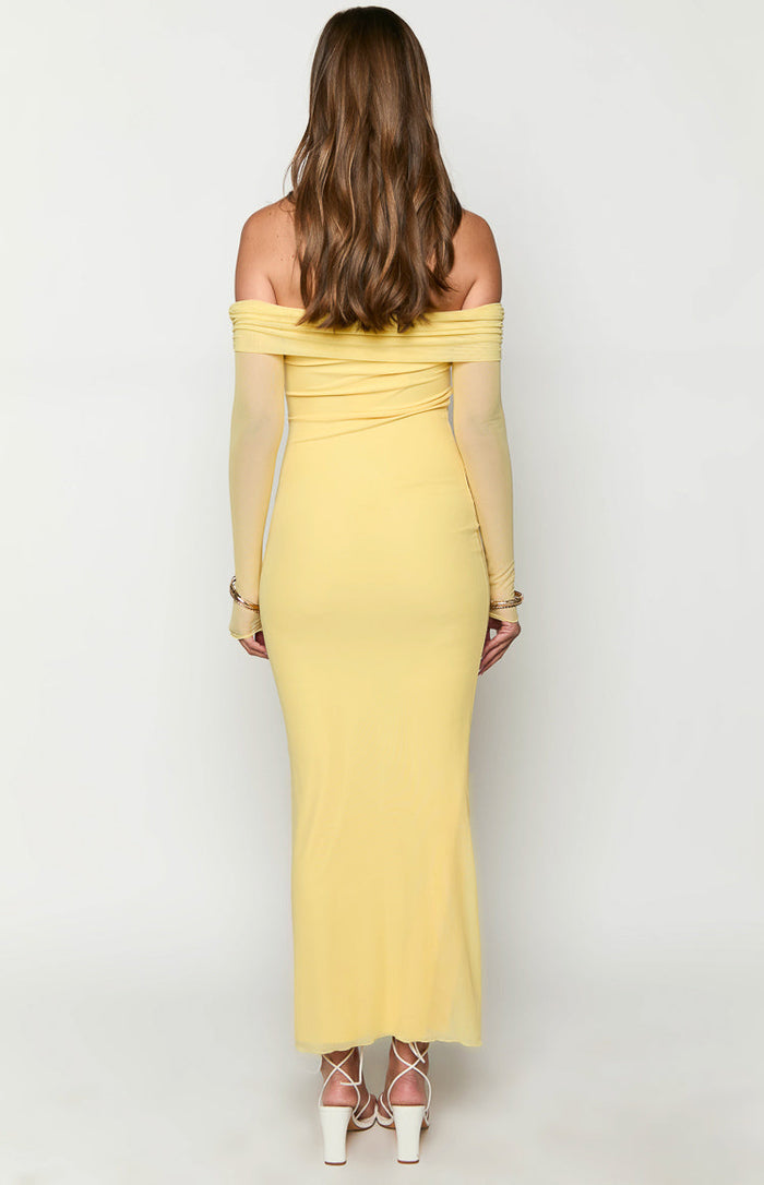 Rear view of a yellow off-shoulder maxi dress with sheer long sleeves and a fitted silhouette