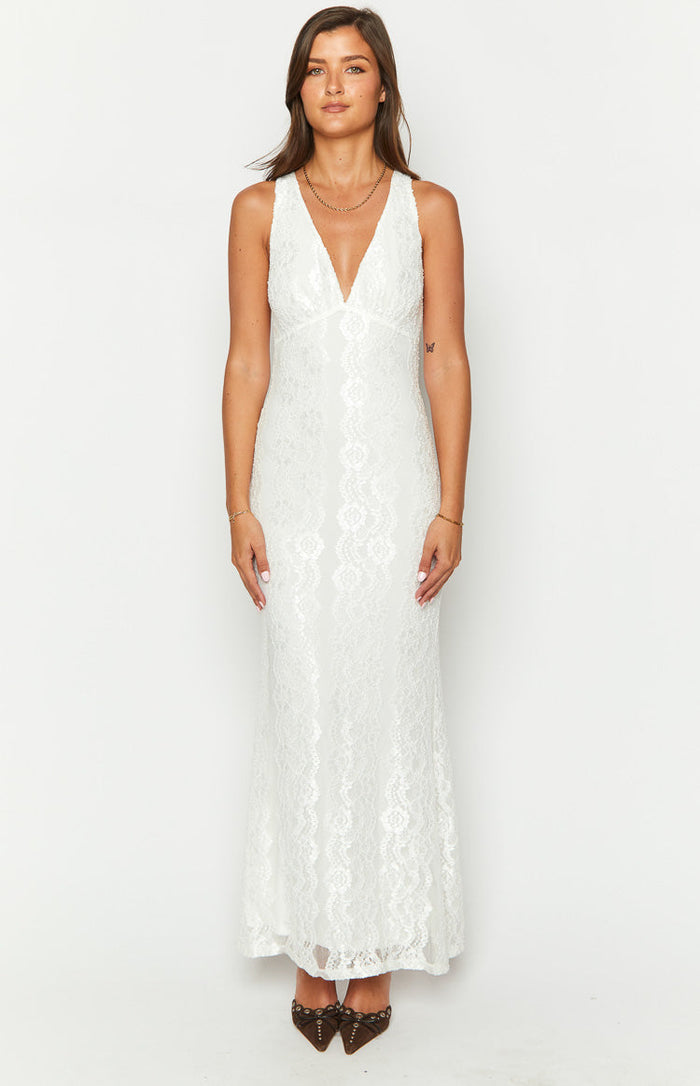 Front view of a white sleeveless maxi dress with a deep V-neck and all-over floral lace