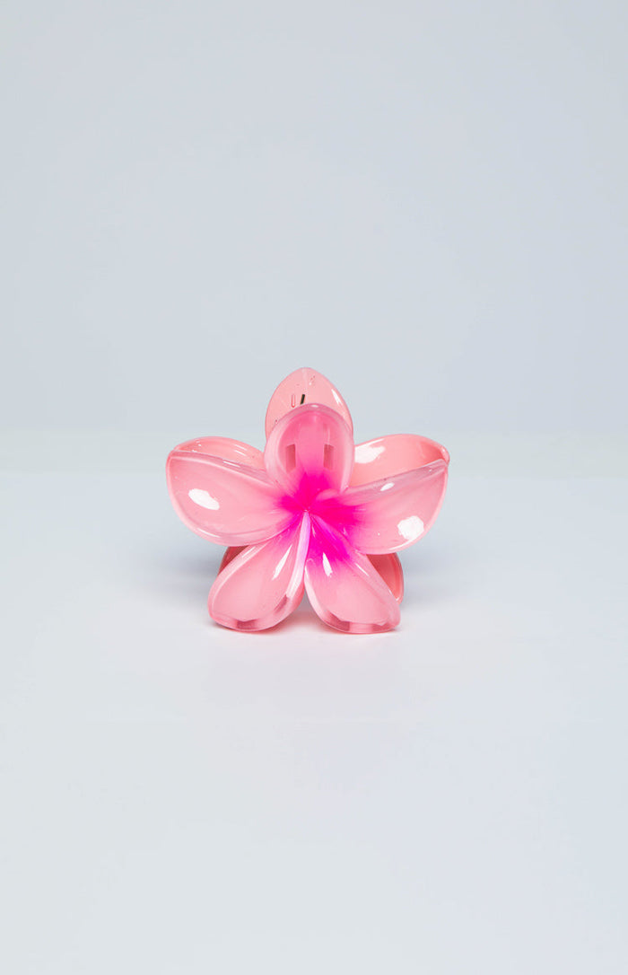 Translucent pink frangipani flower claw clip with a vibrant pink center