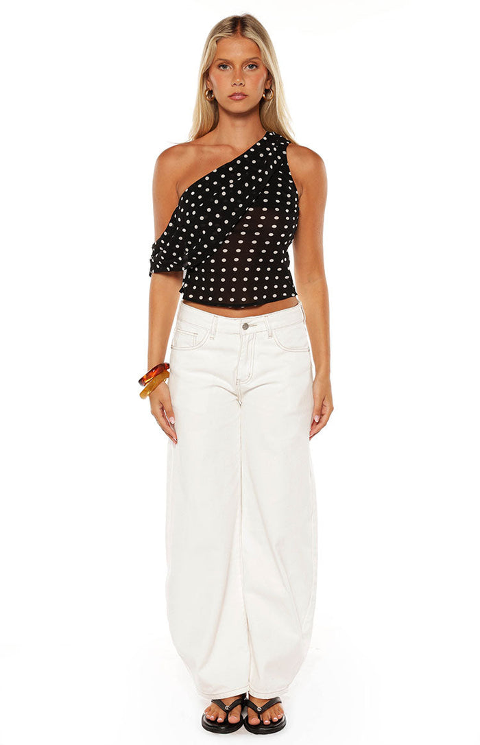 Front view of white denim barrel leg jeans with a relaxed fit and visible front pockets