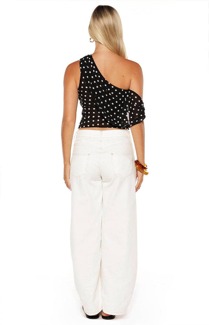 Rear view of white denim barrel leg jeans showing the back pockets and contrast stitching