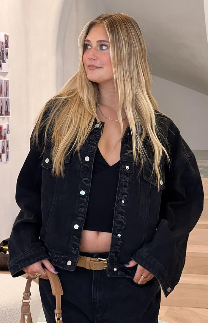 Beginning Boutique Hugo Black Oversized Denim Jacket washed black oversized denim jacket with distressed details and silver buttons