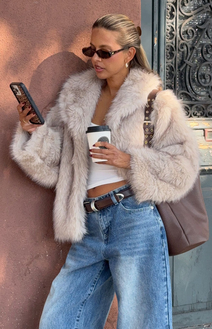 Beginning Boutique It Girl Sand Faux Fur Jacket sand faux fur jacket with a wide collar and long sleeves