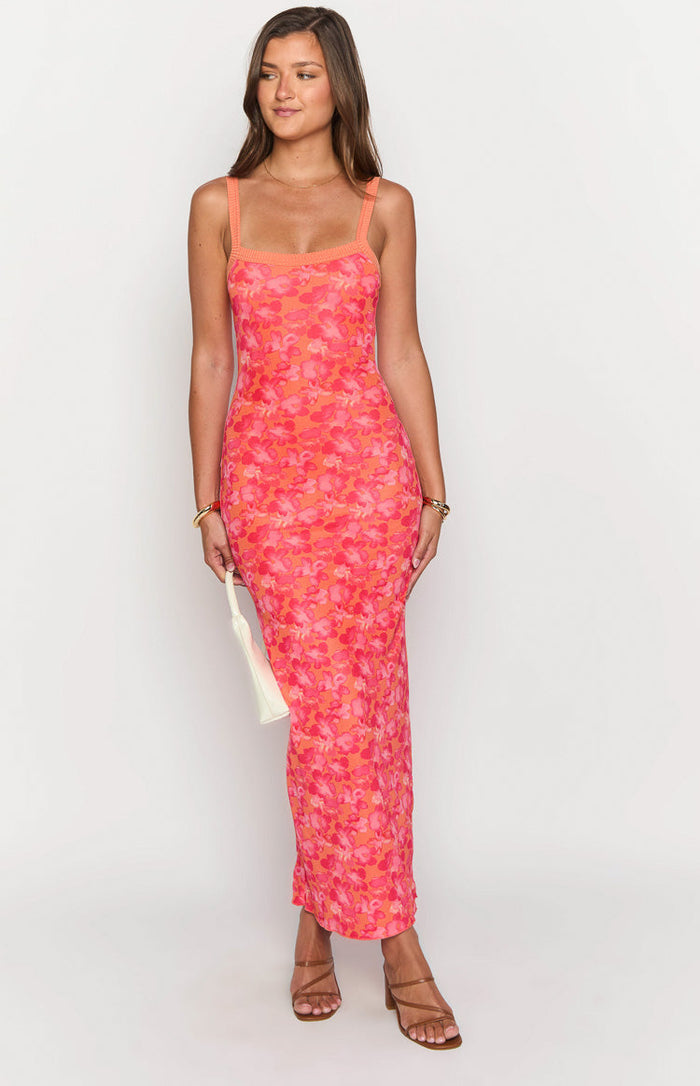 Ribbed knit square neckline and thick straps of an orange and pink floral maxi dress