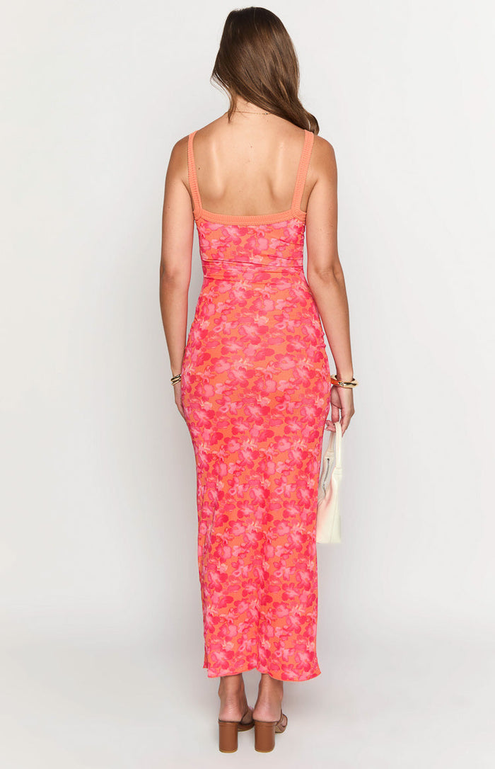 Rear view of a fitted orange floral maxi dress with a straight back and wide ribbed straps