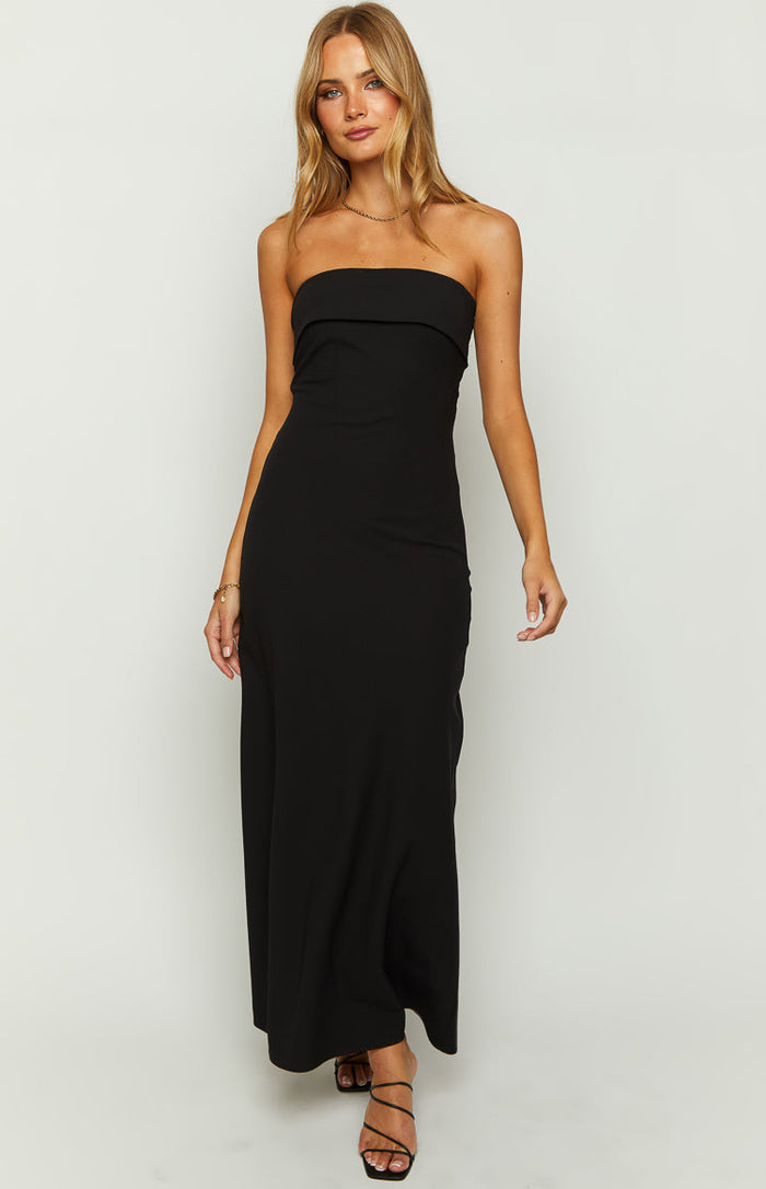Black strapless maxi dress with a folded bandeau neckline and a fitted bodice flowing into a relaxed skirt