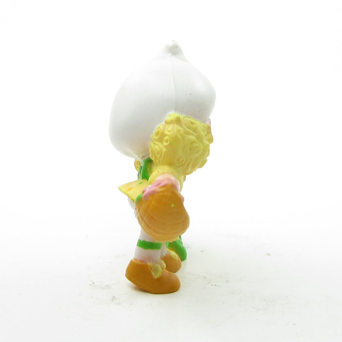 Side of Lemon Meringue picking a flower miniature figurine
