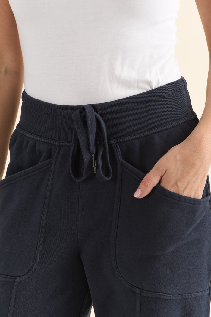 Leo Navy Cotton Sweatpants,brunette model,Close up of outfit,alt text|model:MJ