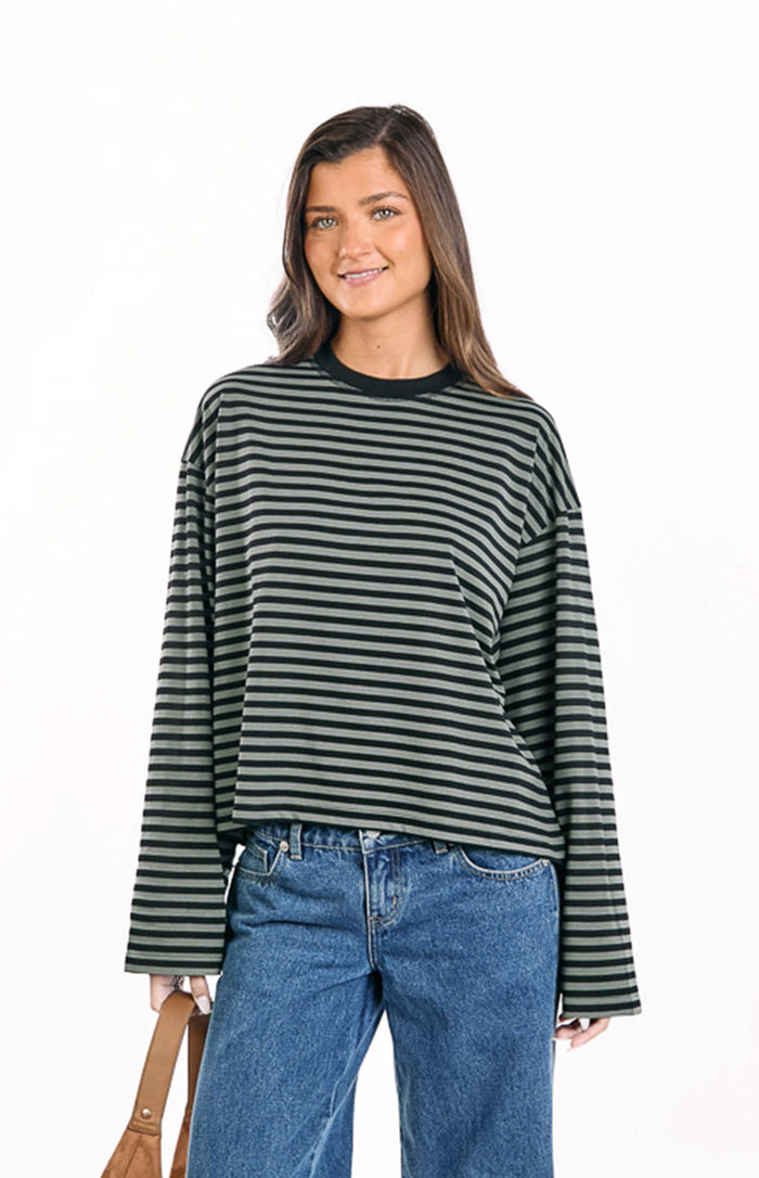 Front view of an olive green and black striped long sleeve top with a relaxed fit and crew neck