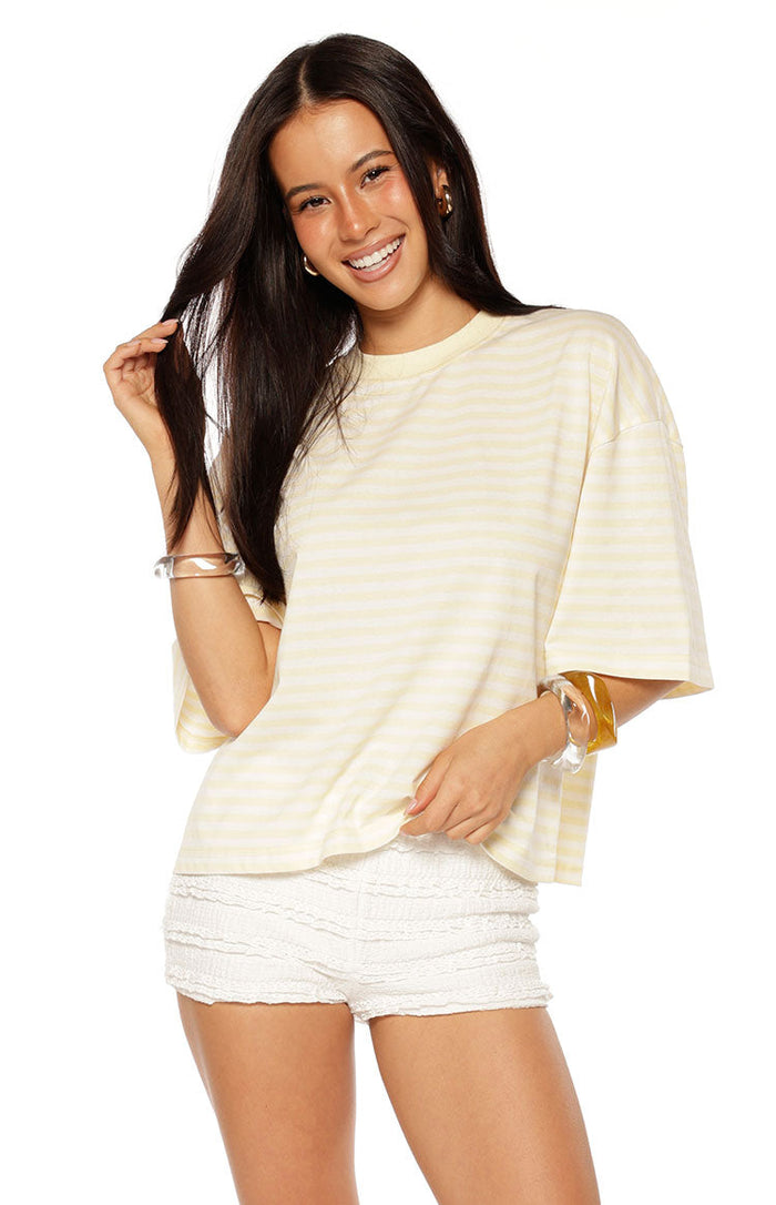 Front view of a relaxed fit yellow and white horizontal striped short sleeve top with a crew neck