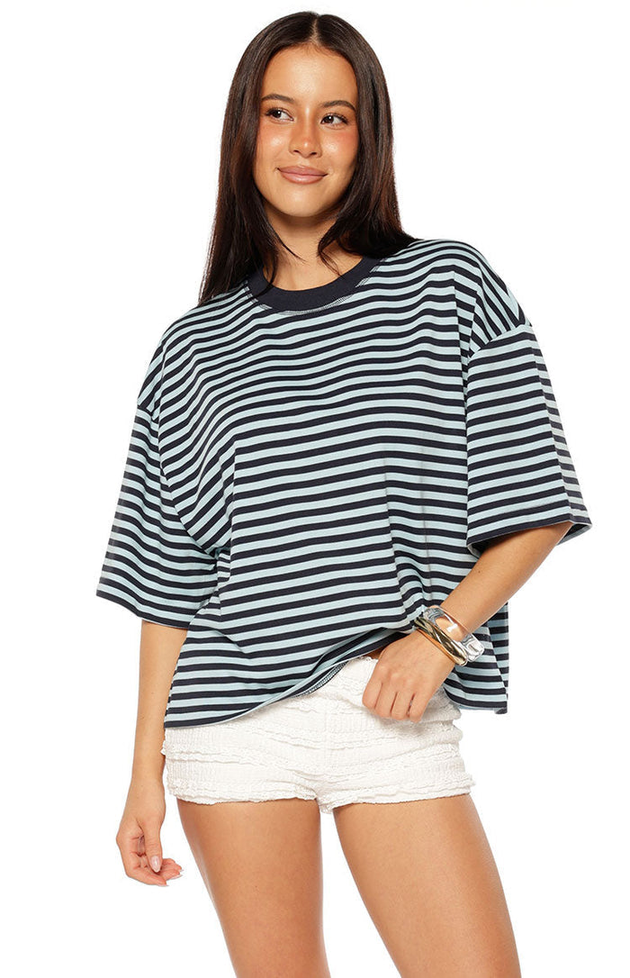 Navy and light blue striped oversized short sleeve top with dropped shoulders and a crew neck