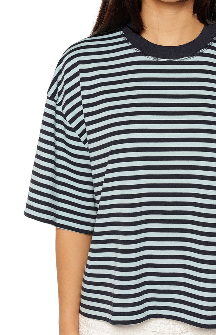 Close-up of the navy and light blue striped short sleeve top showing the ribbed crew neck and relaxed fit sleeve