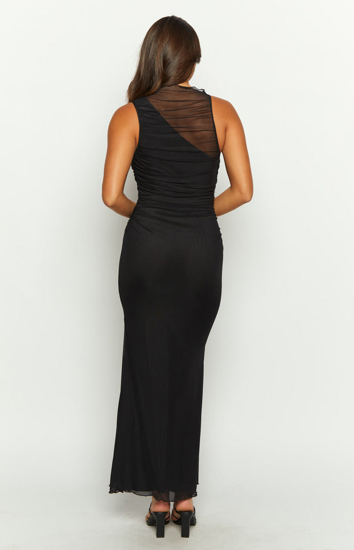 Rear view of a black maxi dress with a ruched sheer mesh asymmetrical back and fitted body