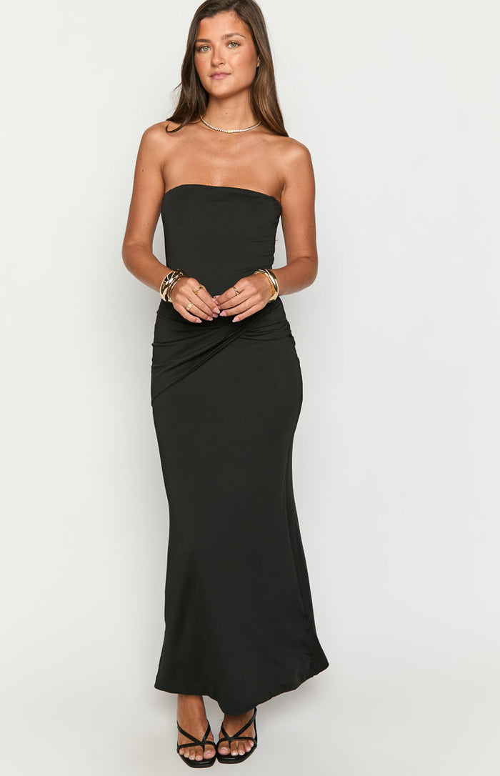 Black strapless maxi dress with a twisted ruched detail at the waist and a bodycon fit