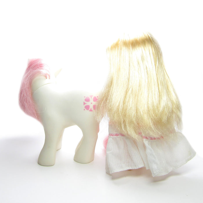 Back of Megan and Sundance pony and human friend set