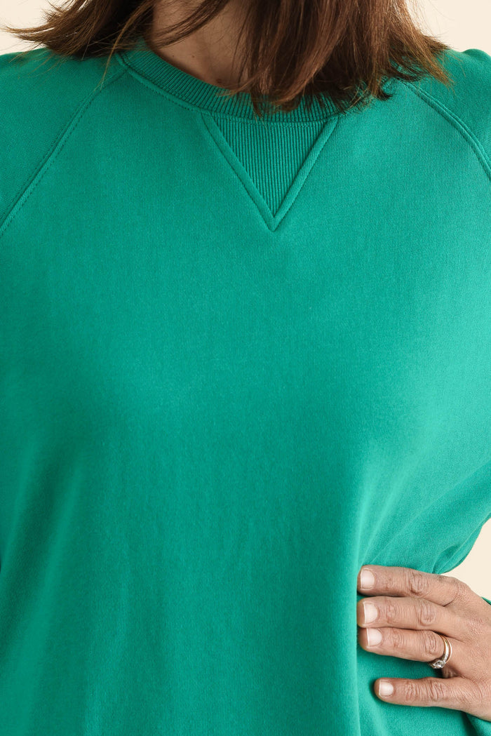 Melbourne Green Cotton Crewneck Sweatshirt,brunette model,Close up of outfit,alt text|model:Cara