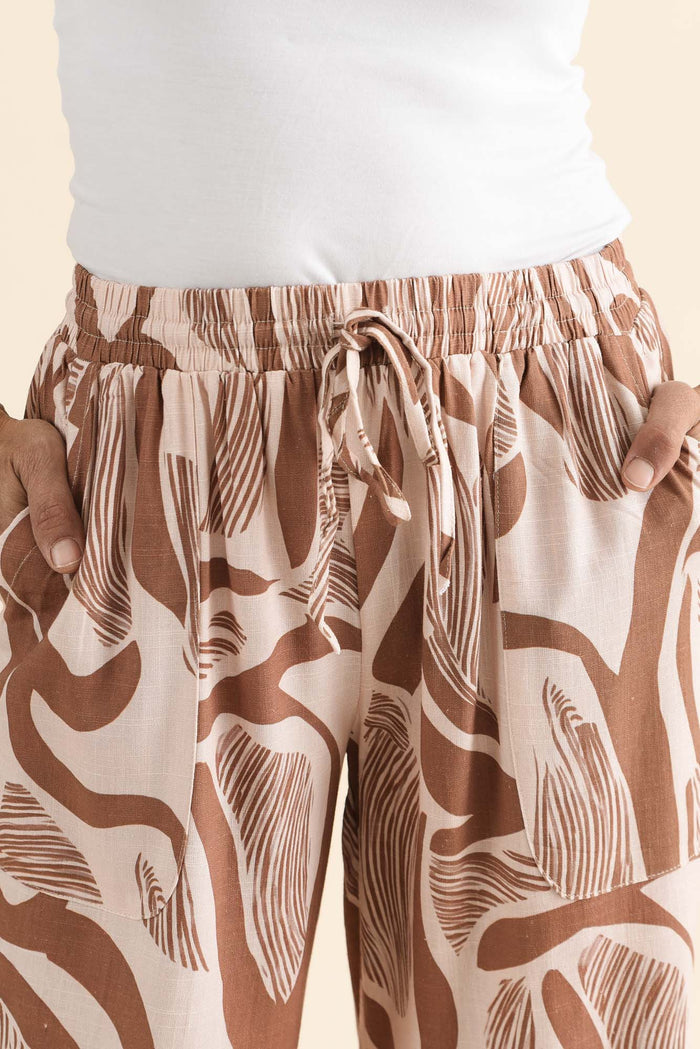 Minnelli Tan Abstract Linen Cotton Pants,brunette model,Close up of outfit,alt text|model:Cara