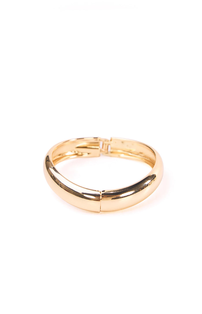 Gold bangle with the clasp open showing the hinge mechanism