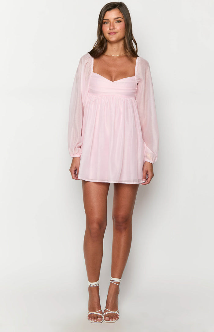 Pink long sleeve mini dress with a sweetheart neckline, gathered underbust, and sheer puff sleeves