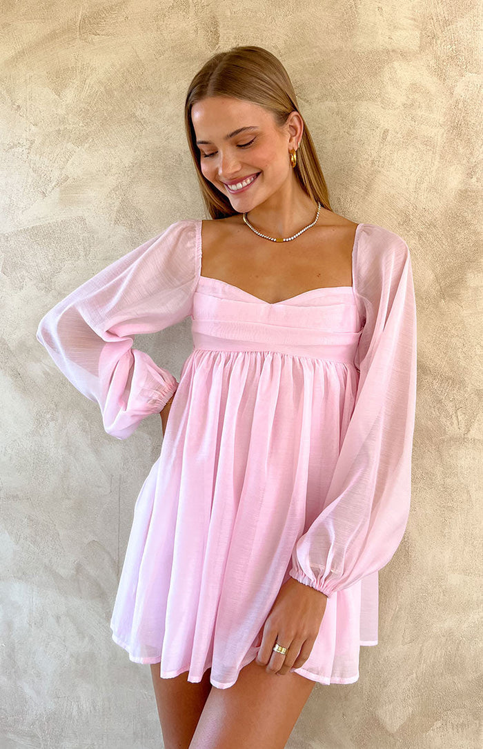 Light pink mini dress with a square neckline, sheer long puff sleeves, and a gathered babydoll skirt