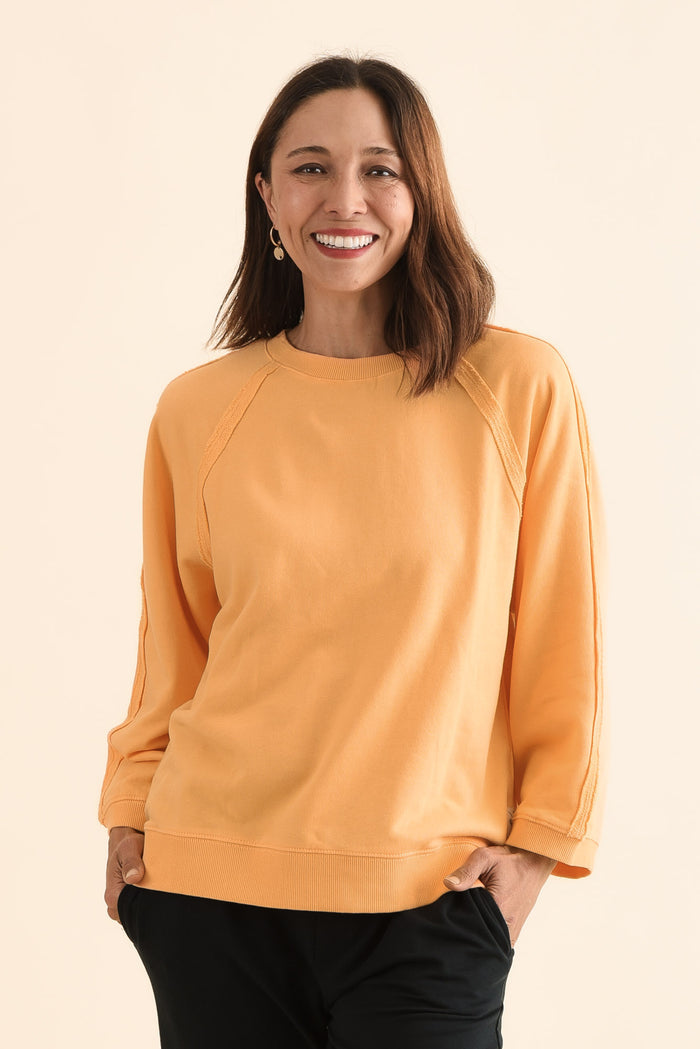 Nessa Peach Cotton Frayed Sweatshirt,Front,Brunette model,alt text|model:Cara