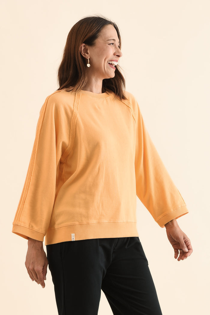 Nessa Peach Cotton Frayed Sweatshirt,Side,Brunette model,alt text|model:Cara