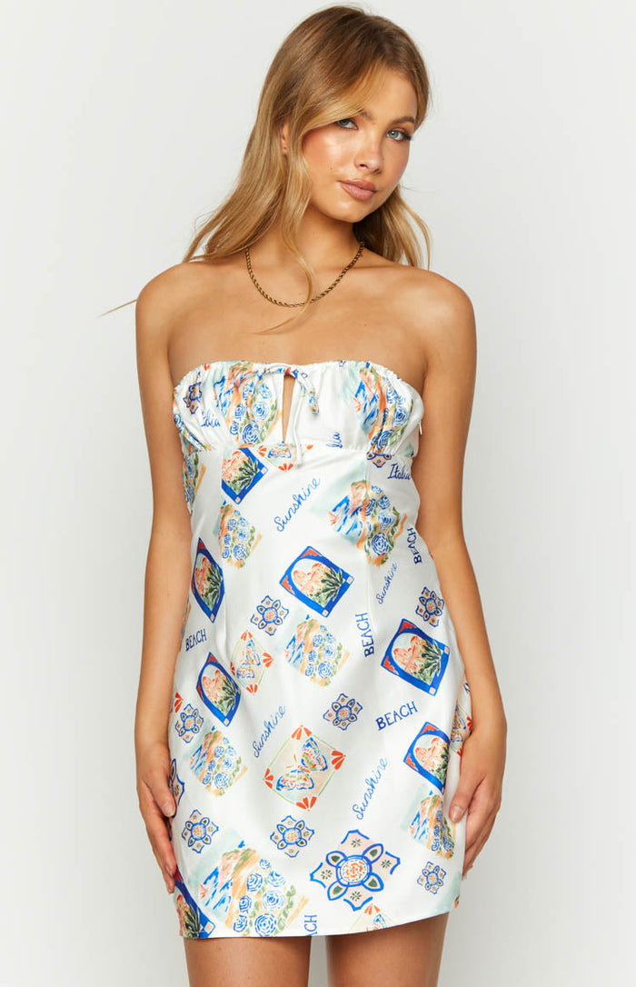 White strapless mini dress with a blue and orange Italia print, featuring a small keyhole cutout and tie detail at the bust