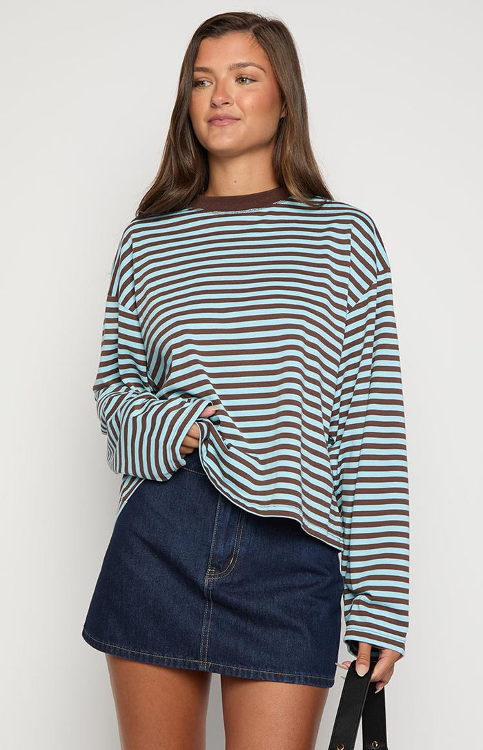 Front view of a dark wash denim mini skirt with yellow contrast stitching and an A-line cut