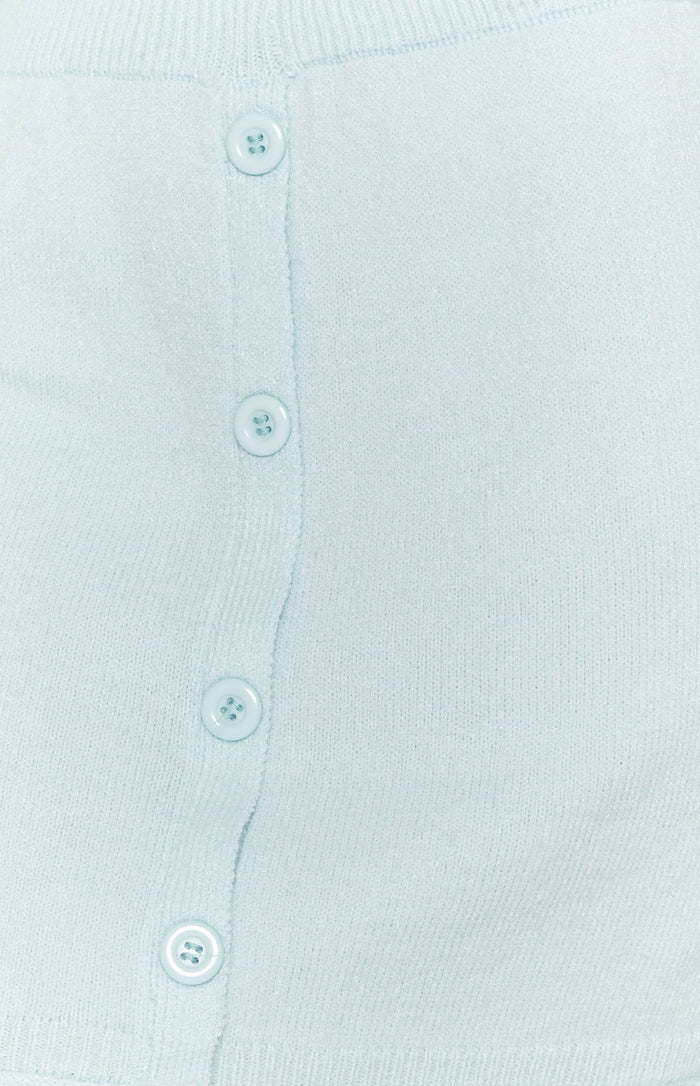 Soft light blue knit skirt fabric with a vertical row of four round matching buttons
