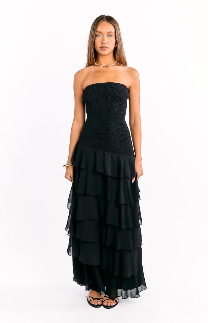 Black strapless maxi dress with a shirred bodice and tiered ruffle skirt