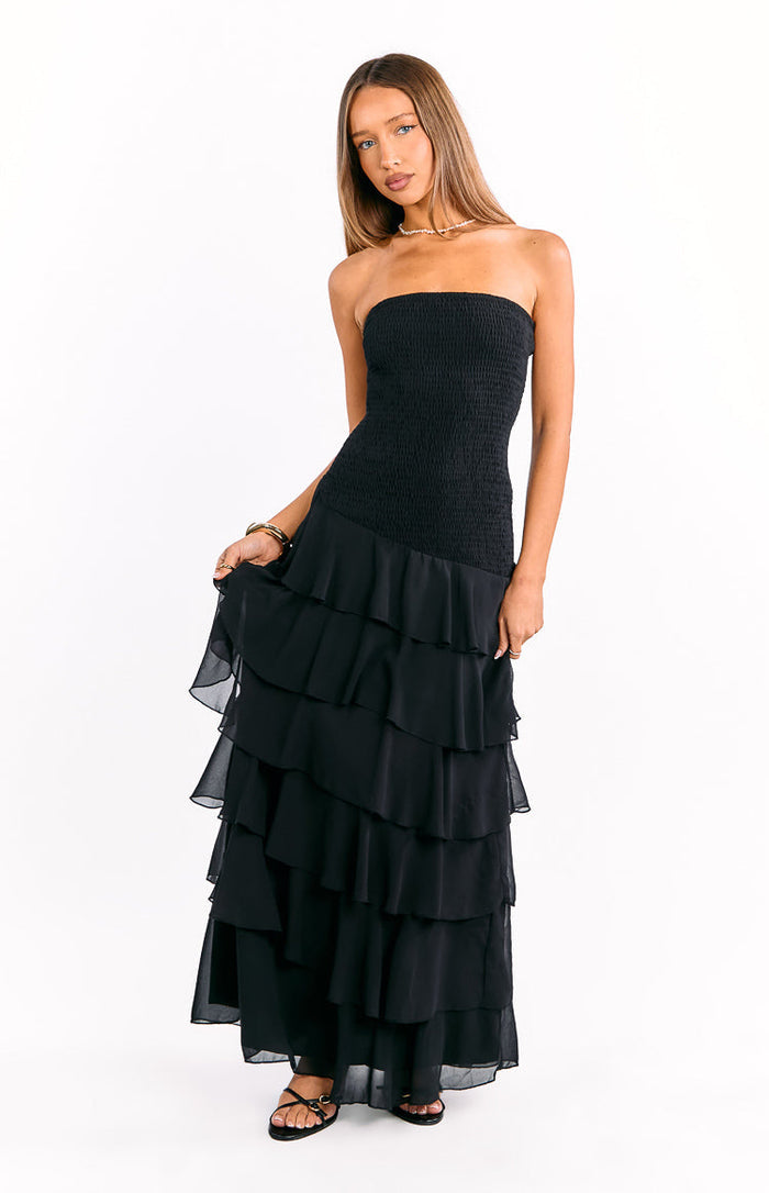 Black strapless maxi dress with a shirred bodice and tiered ruffle maxi skirt