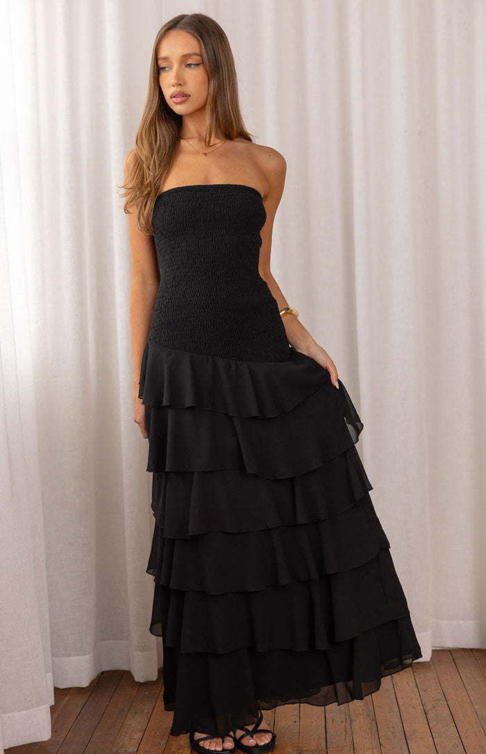 Black strapless maxi dress with a shirred bodice and a tiered ruffle skirt