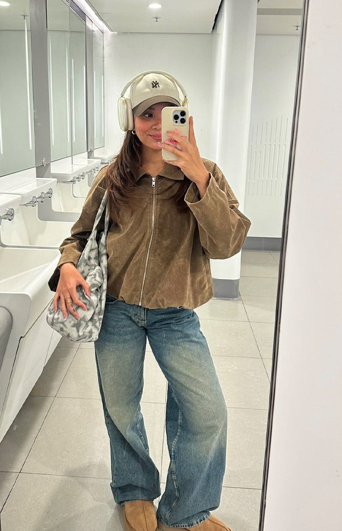 Beginning Boutique River Brown Suedette Bubble Hem Bomber Jacket brown suedette jacket with a collar, zip front, and bubble hem