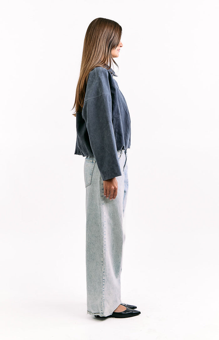 Side view of a steel grey suedette bomber jacket with a cropped, relaxed fit and bubble hem