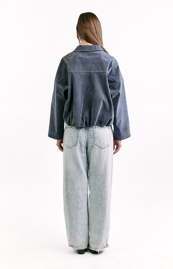 Rear view of a steel grey suedette bomber jacket with a wide collar and elasticated bubble hem
