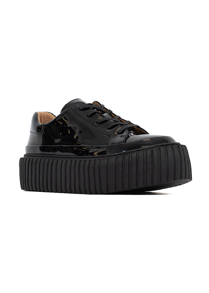 A picture of a Black glossy patent leather Shoe. Showing the matching platform sole with a finishing classic lace up.