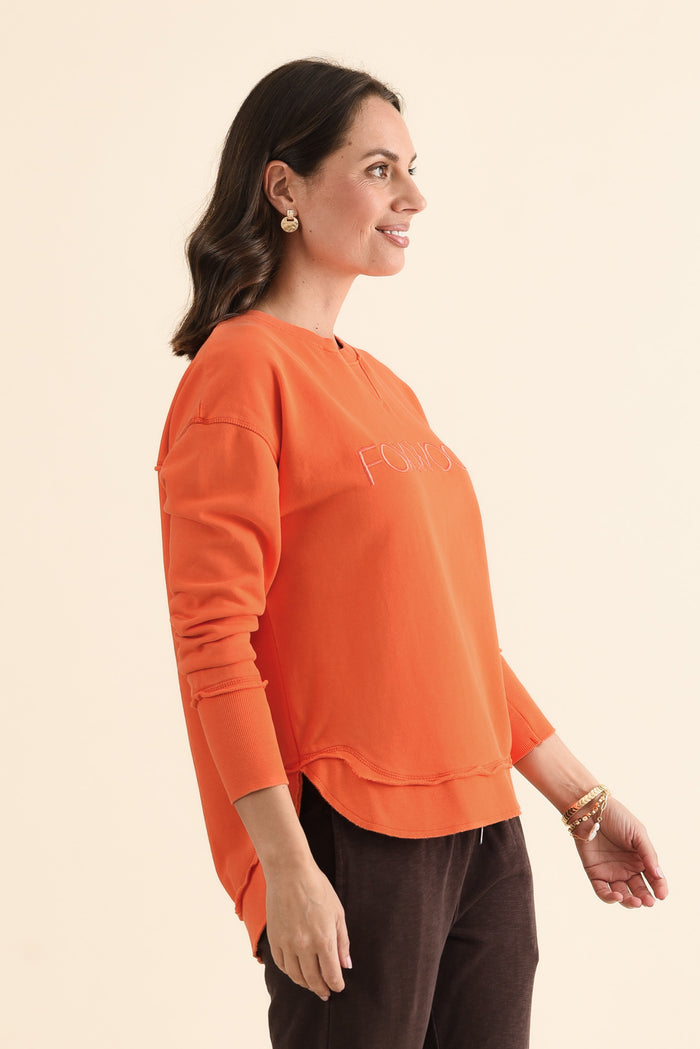 Simplified Orange Cotton Crewneck Sweatshirt,brunette model,Side of Outfit,alt text|model:MJ